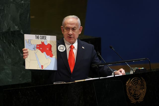 <p>Netanyahu addresses the 80th United Nations General Assembly, holding a map titled ‘The Curse’</p>