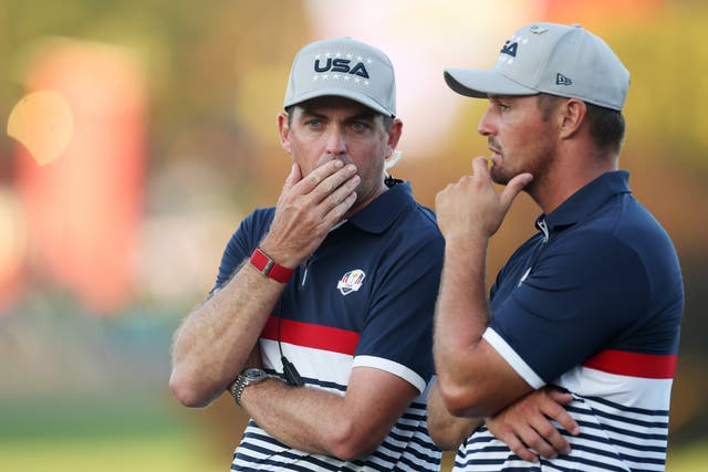 <p>Captain Keegan Bradley and Bryson DeChambeau of Team United States look on</p>