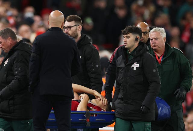 <p>Arne Slot (left) watches on as Giovanni Leoni is stretchered off</p>