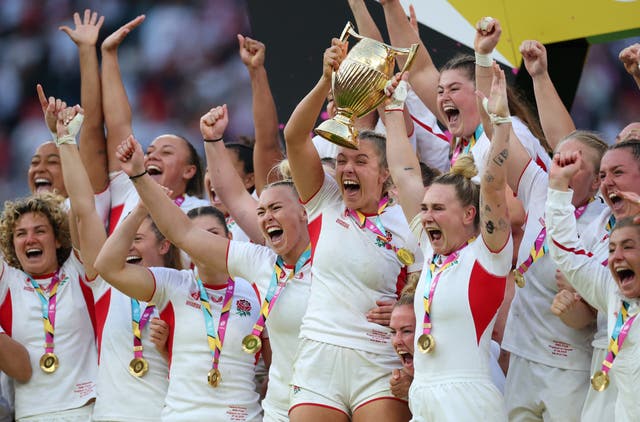 <p>Zoe Aldcroft and Megan Jones lift the trophy after winning the final</p>