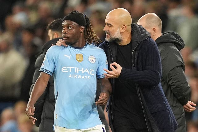 Pep Guardiola, right, was impressed by Jeremy Doku in Man City’s win (Martin Rickett/PA)