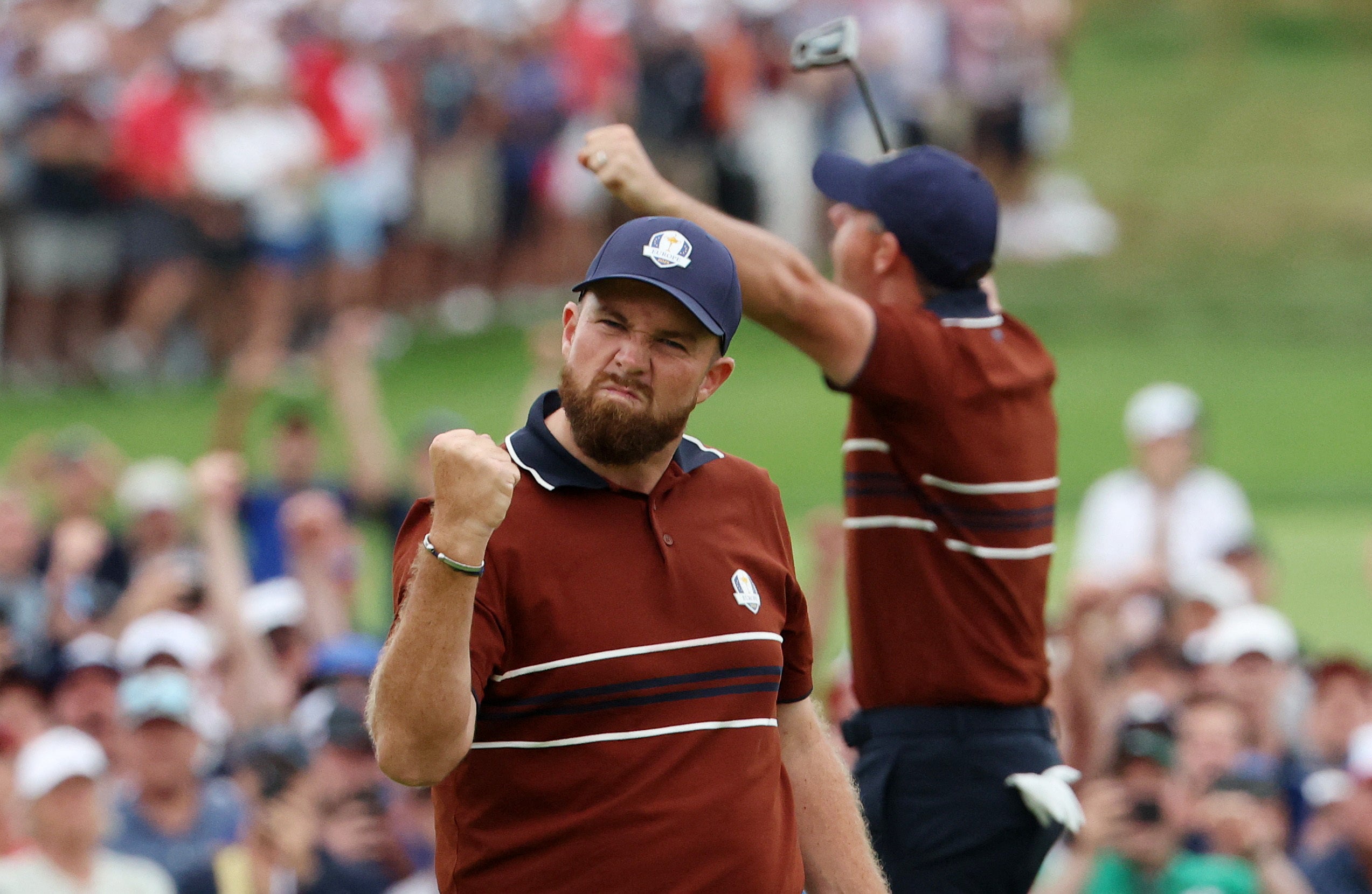 Lowry and McIlory celebrate their victory