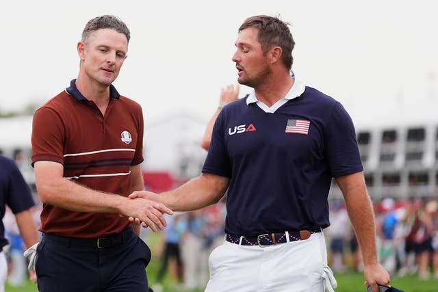 <p>Bryson DeChambeau and Justin Rose talk after their match</p>