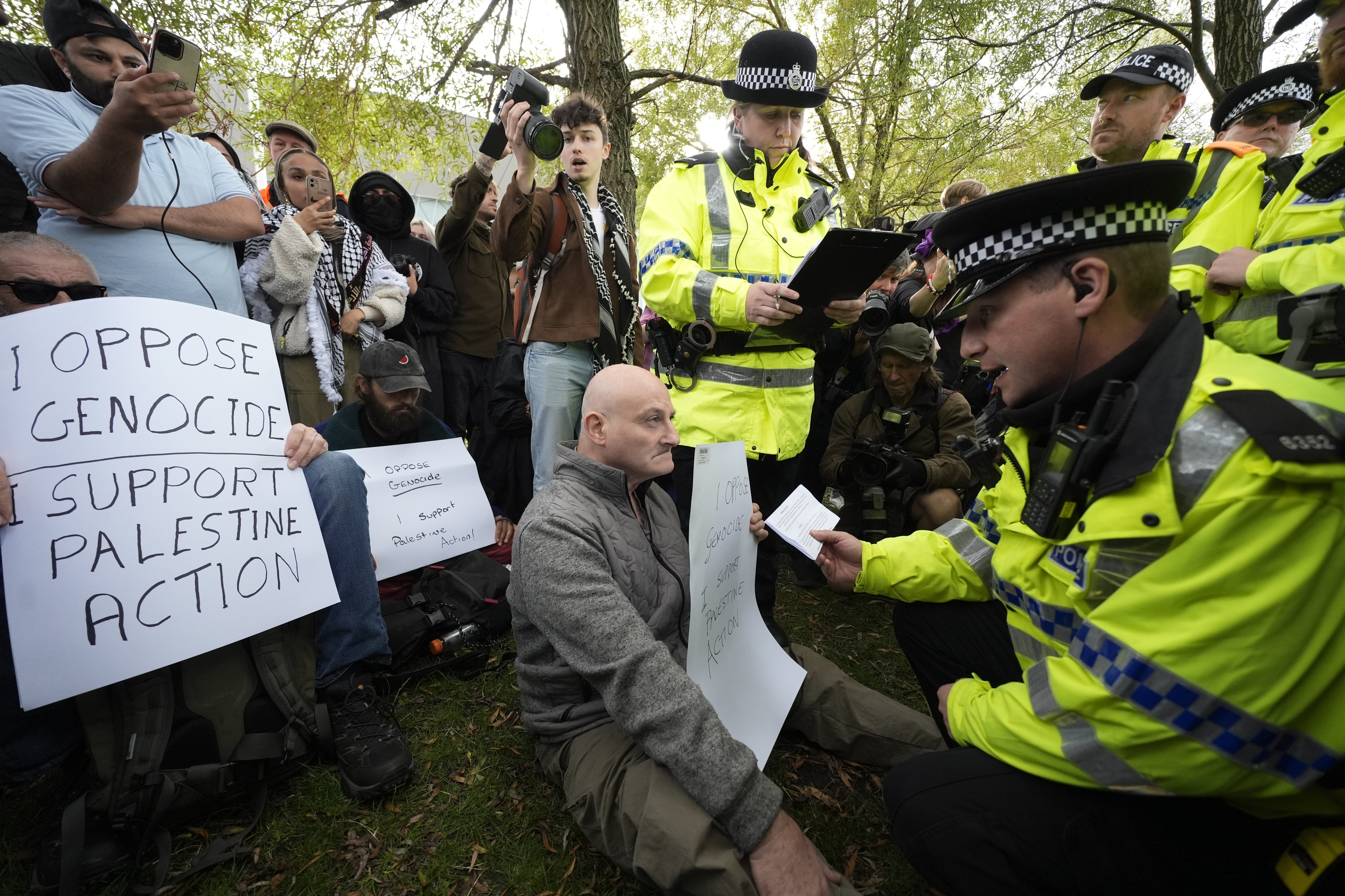 A demonstrator is read his rights by police at a Palestine Action protes