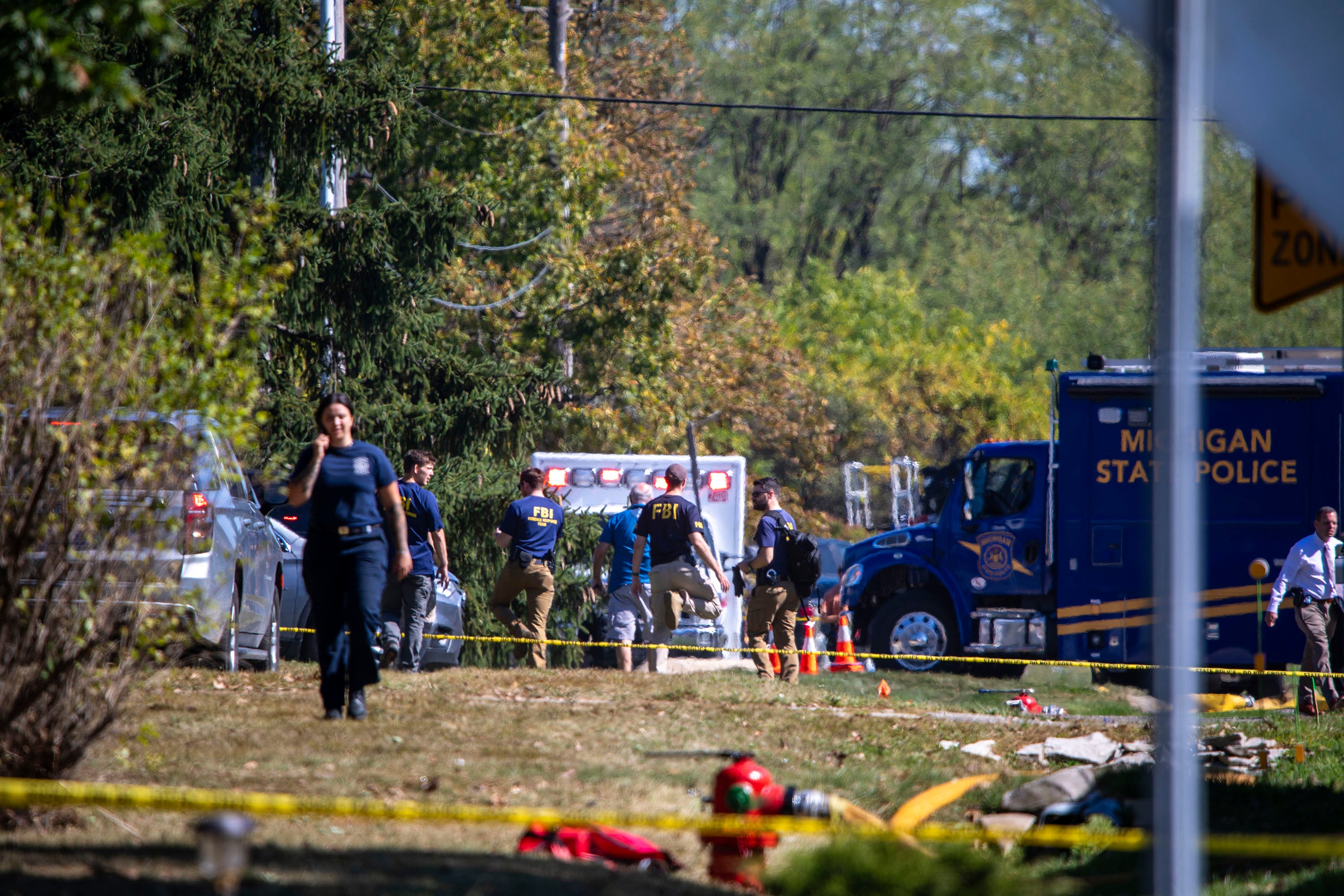 After fleeing the building, the suspect exchanged gunfire with two officers and was killed
