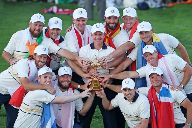 <p>Team Europe hold their trophy after their Ryder Cup win</p>