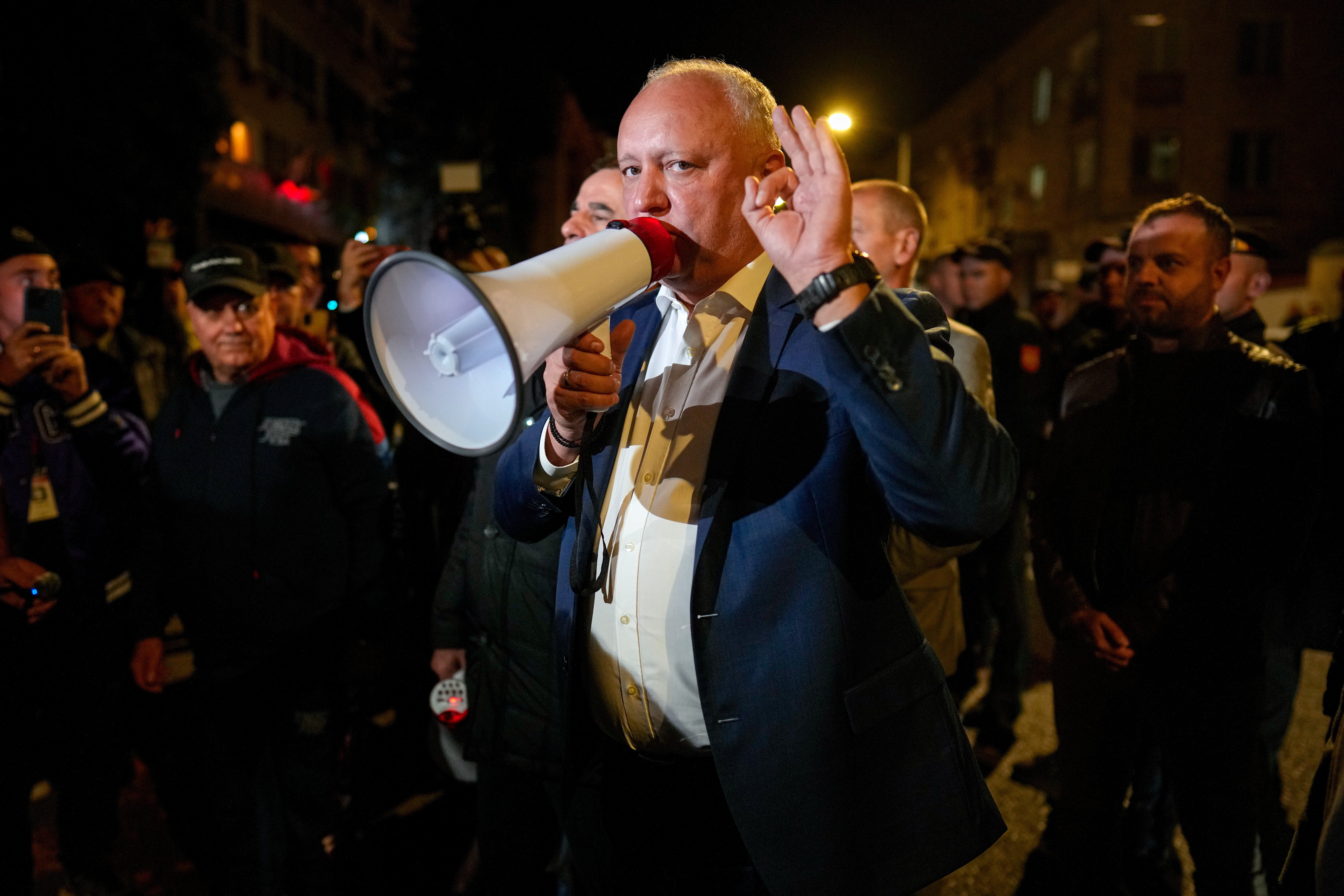 Former Moldovan President Igor Dodon, a member of the pro-Russian Patriotic Electoral Bloc, speaks to supporters protesting outside the Electoral Commission after the polls closed for the parliamentary election, in Chisinau, Moldova, Sunday, Sept. 28, 2025. (AP Photo/Vadim Ghirda)