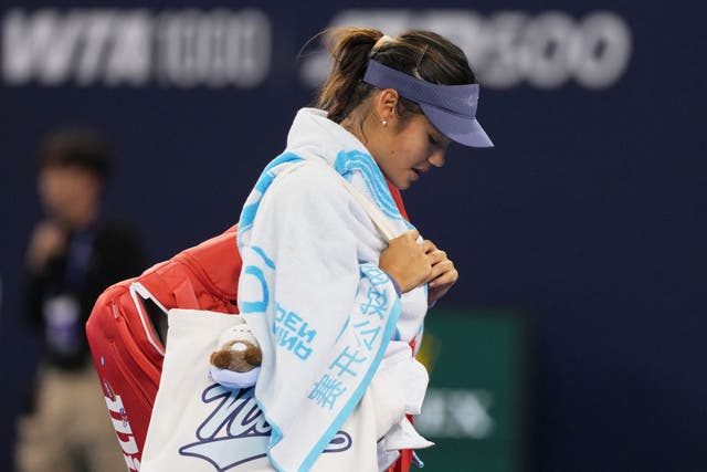 <p>Emma Raducanu leaves the court after her third-round defeat to Jessica Pegula at the China Open</p>