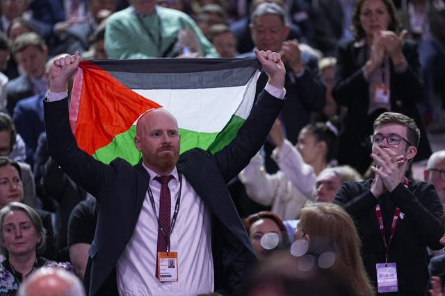 <p>A pro-Palestinian protester interrupted Chancellor of the Exchequer Rachel Reeves’ speech (Peter Byrne/PA)</p>