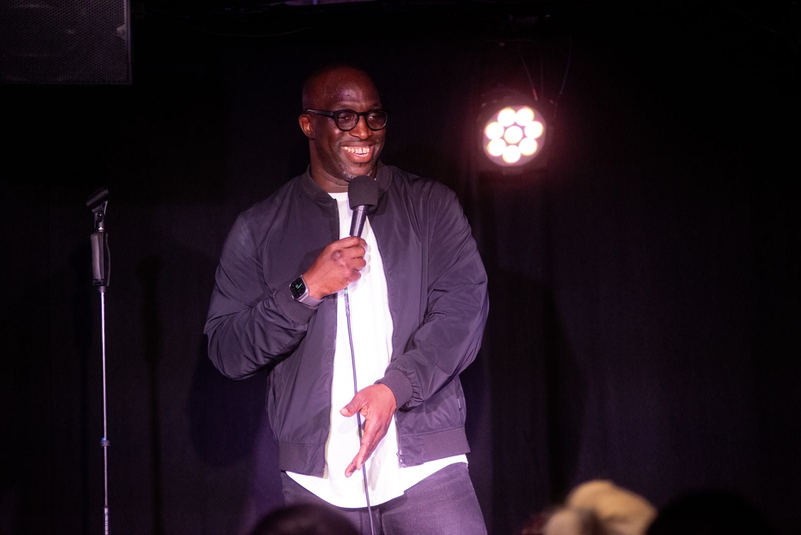 Emmanuel Sonubi performing on stage