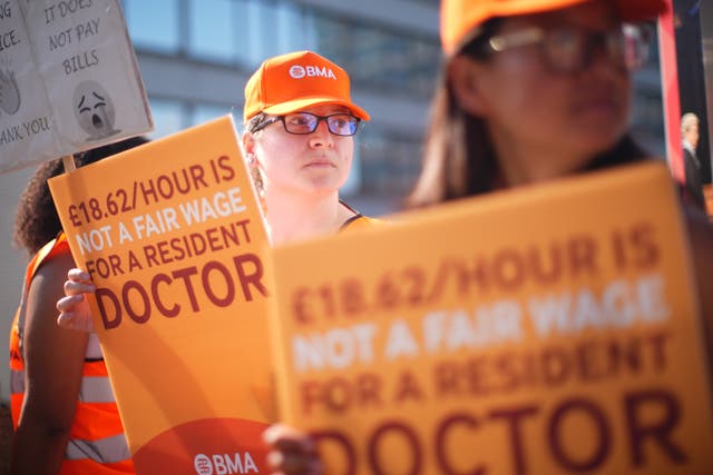 NHS resident doctors and supporters outside St Thomas’ Hospital in London during July’s strike (James Manning/PA)