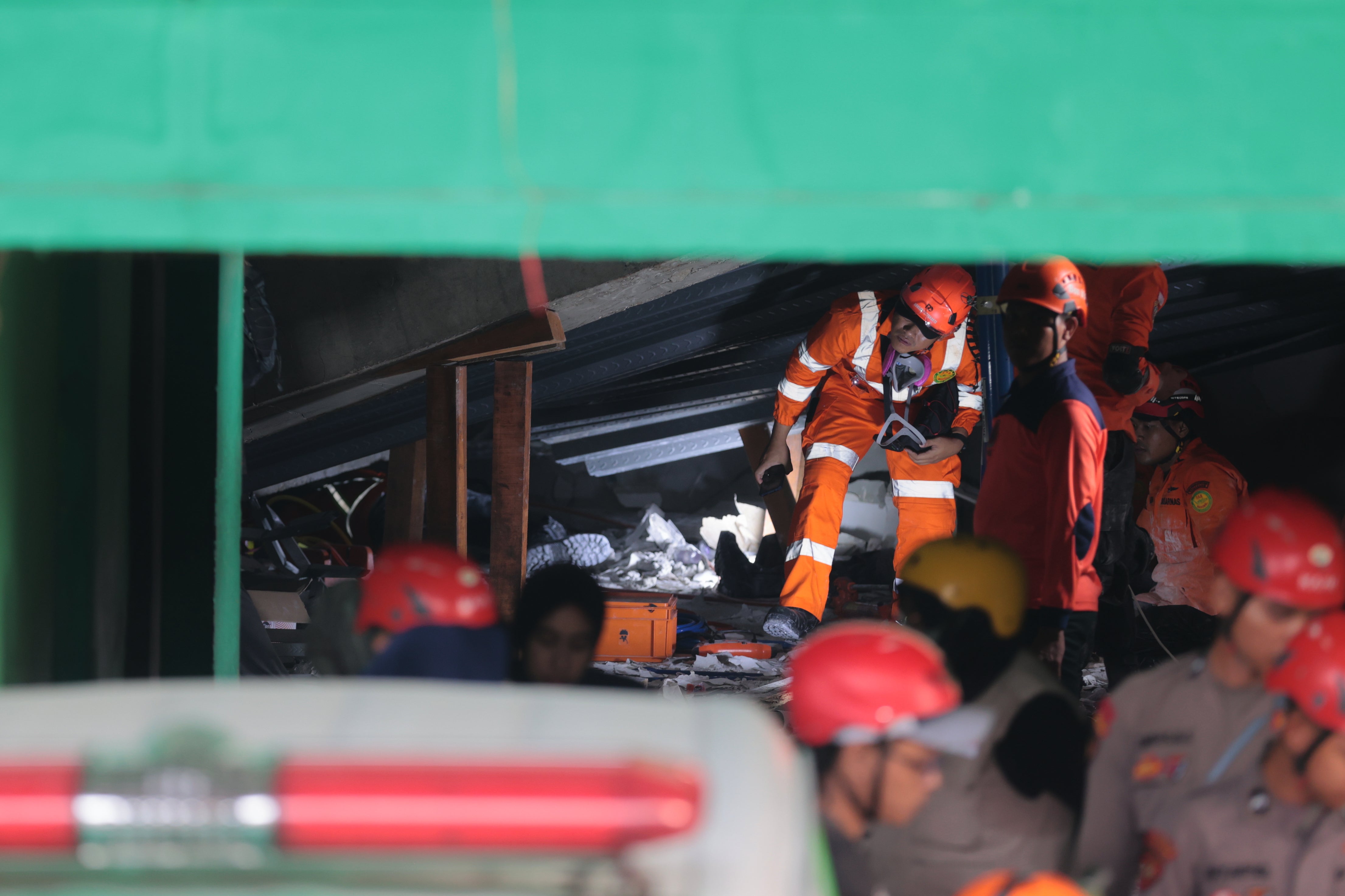 <p>Rescuers search for victims</p>