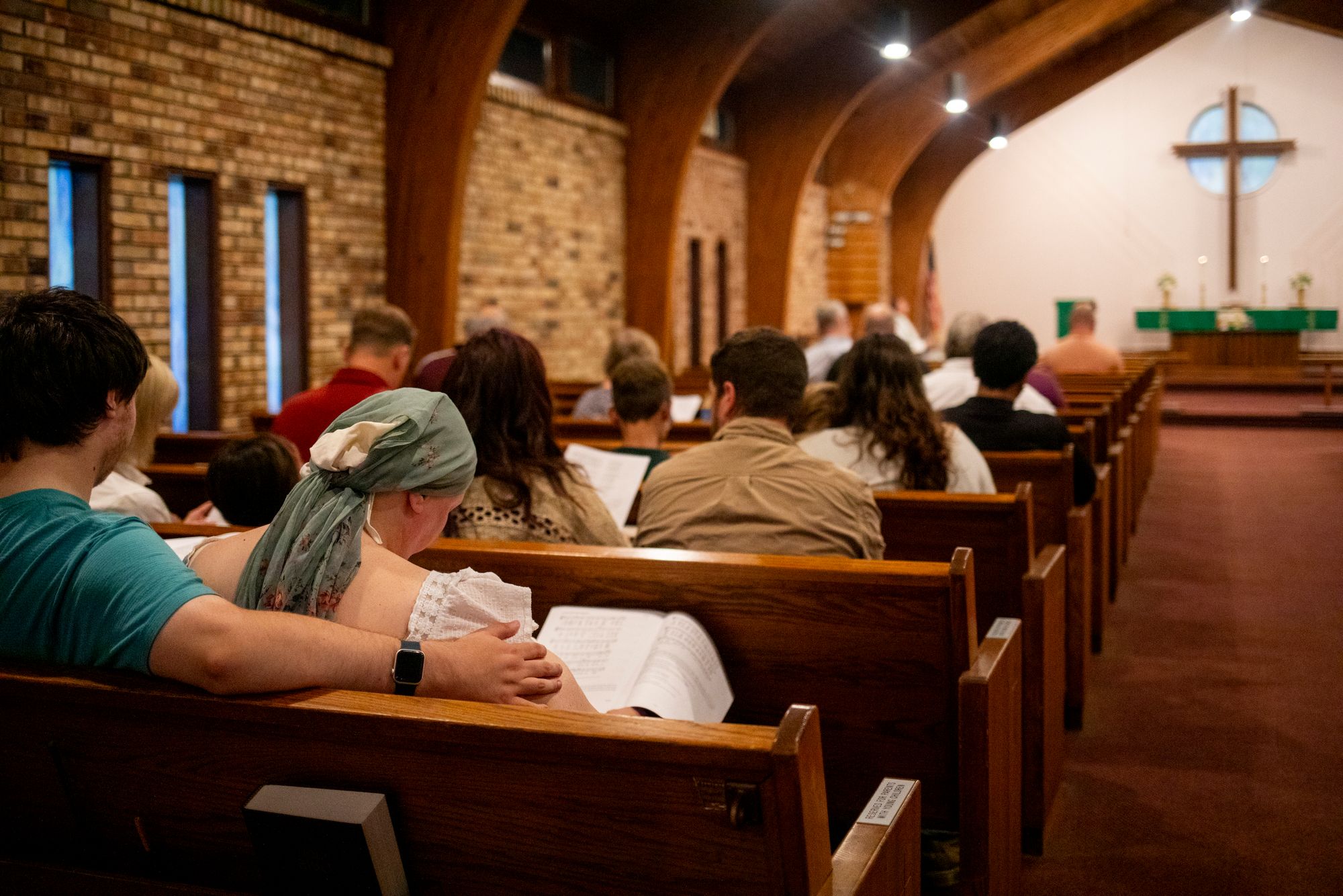 Community members gather at the Gloria Dei Lutheran Church in Grand Blanc Township, Michigan, for a prayer service on Monday, one day after a gunman opened fire at the nearby Church of Jesus Christ of Latter-day Saints. Four people died, and eight were injured, police said