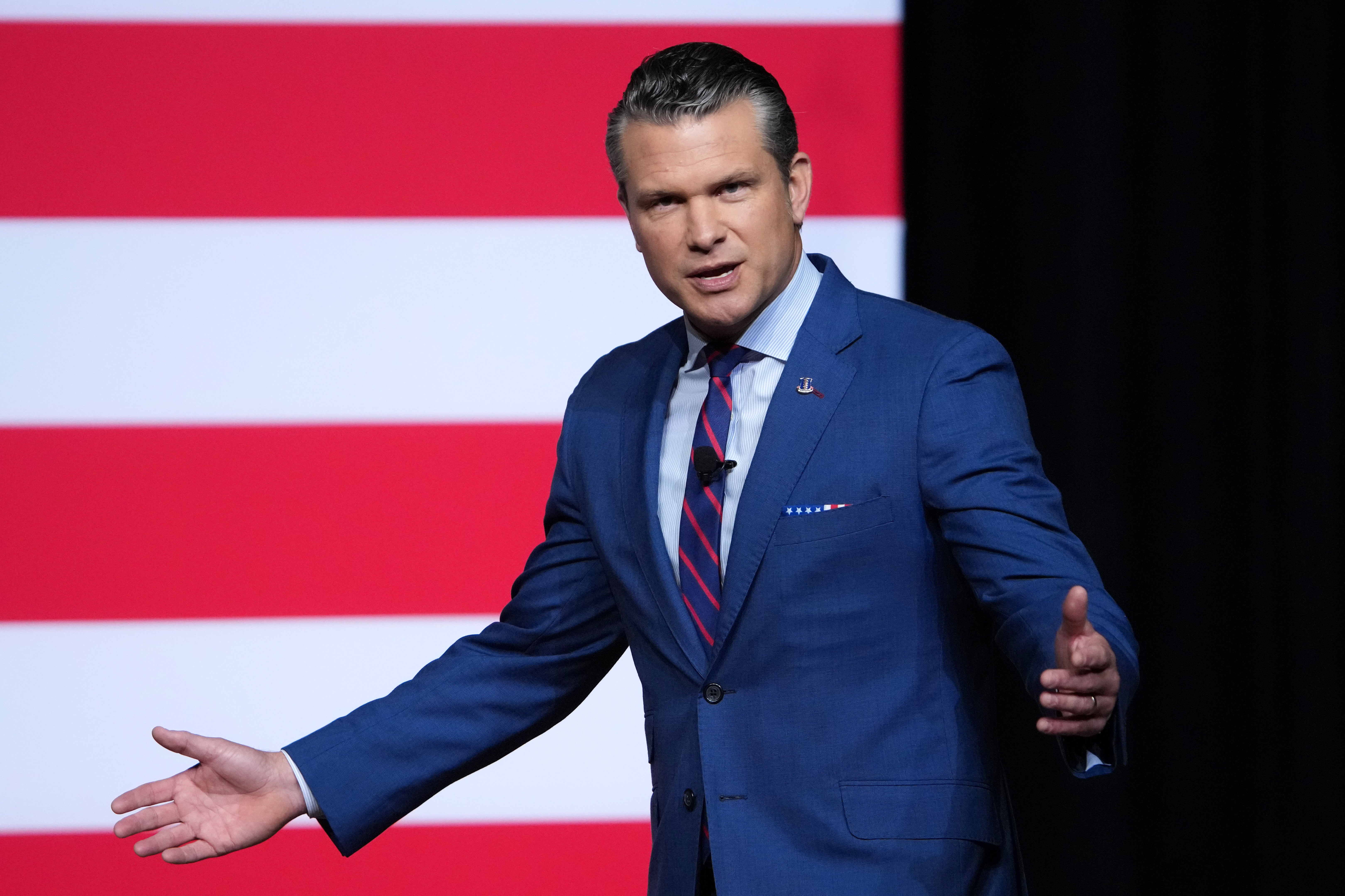 Secretary of Defense Pete Hegseth was greeted with silence after his rally the troops speech to senior military leaders at Marine Corps Base Quantico, Tuesday, Sept. 30, 2025 in Quantico, Va. (Andrew Harnik/Pool via AP)