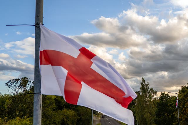 St George’s Cross flags fly from lampposts (PA)