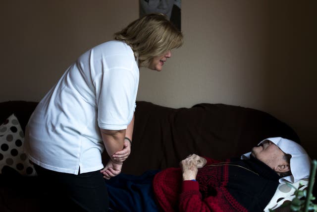 <p>File. A German Red Cross nurse attends to a patient</p>