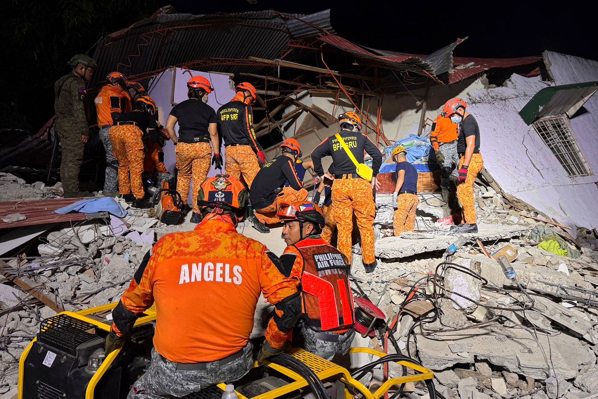 Rescuers search for survivors underneath rubble in Bogo, Philippines