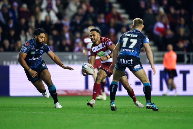<p>Bevan French of Wigan Warriors runs at the Leigh Leopards' defence during a Super League clash in February</p>