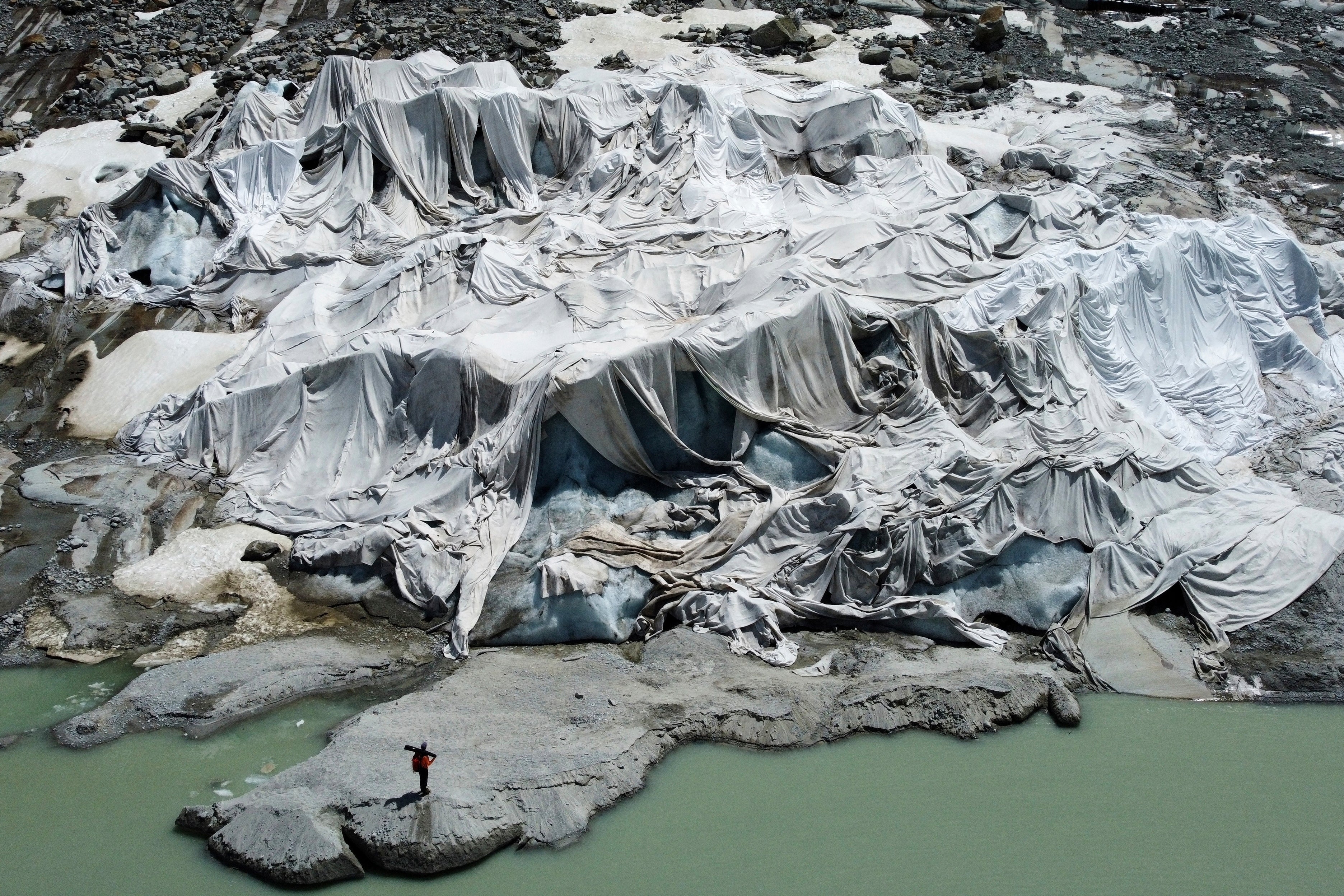 <p>The Rhone Glacier that is partially covered with sheets near Goms, Switzerland</p>