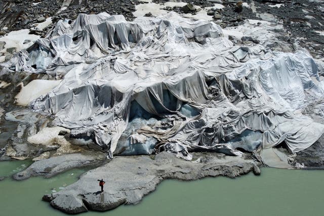<p>The Rhone Glacier that is partially covered with sheets near Goms, Switzerland</p>