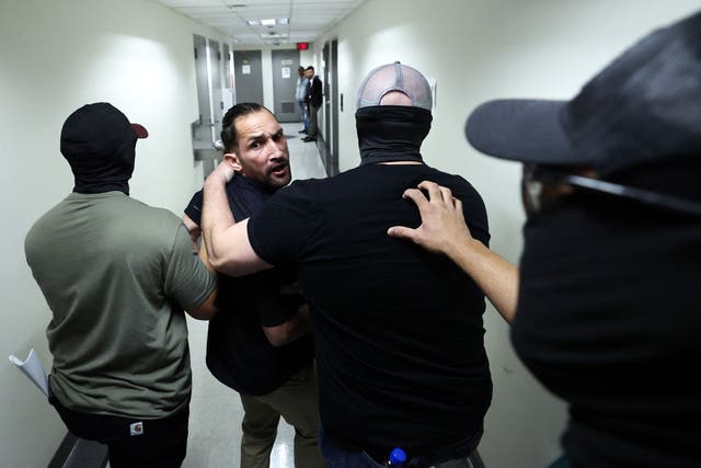 <p>A man is detained by federal agents after his hearing at New York Federal Plaza Immigration Court inside the Jacob K. Javitz Federal Building in New York on October 1, 2025</p>
