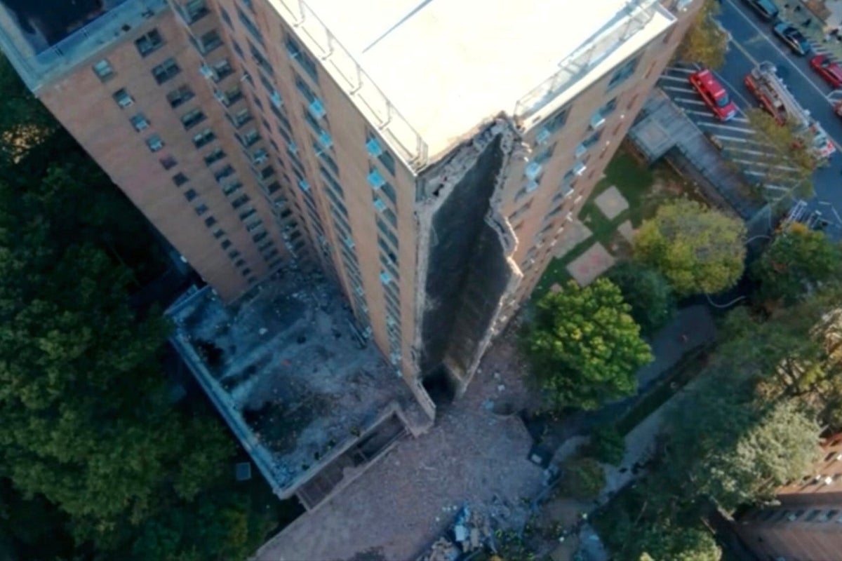 New York apartment building partially collapses in suspected gas explosion