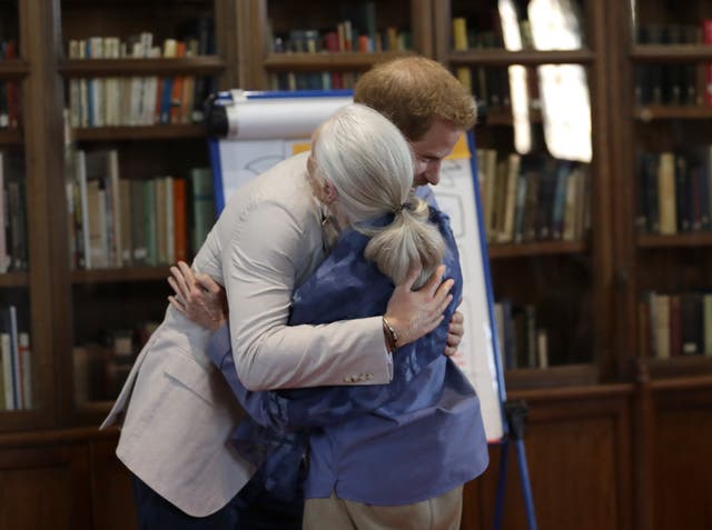 <p>Harry hugging Dame Jane Goodall when he attended her Roots & Shoots global leadership meeting at Windsor Castle in July 2019 (Kirsty Wigglesworth/PA)</p>