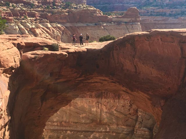 <p>Open space? Tourists standing on Cassidy Arch in Capitol Reef National Park in Utah</p>