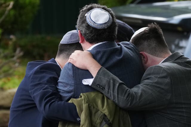 <p>Members of the public react as they gather near the Heaton Park Hebrew Congregation Synagogue, where multiple were injured after stabbing and car attack on Yom Kippur, on October 2, 2025 in the Crumpsall suburb of Manchester, England</p>