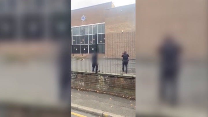 ‘Get back... he has a bomb’: Armed police at the Manchester synagogue attack warned the public to stay away