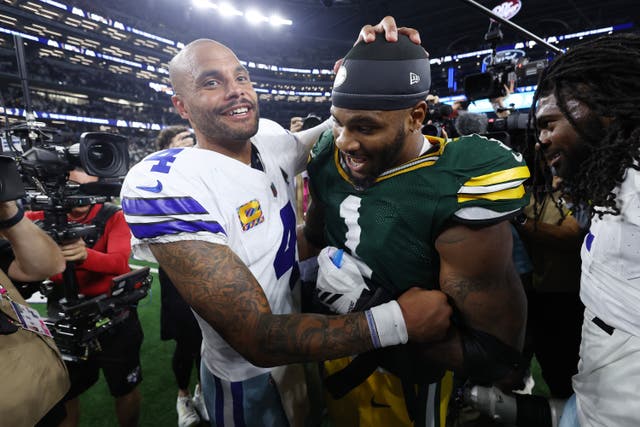 <p>Dak Prescott of the Dallas Cowboys embraces Green Bay Packers’ Micah Parsons after a tie game in overtime on Sunday</p>