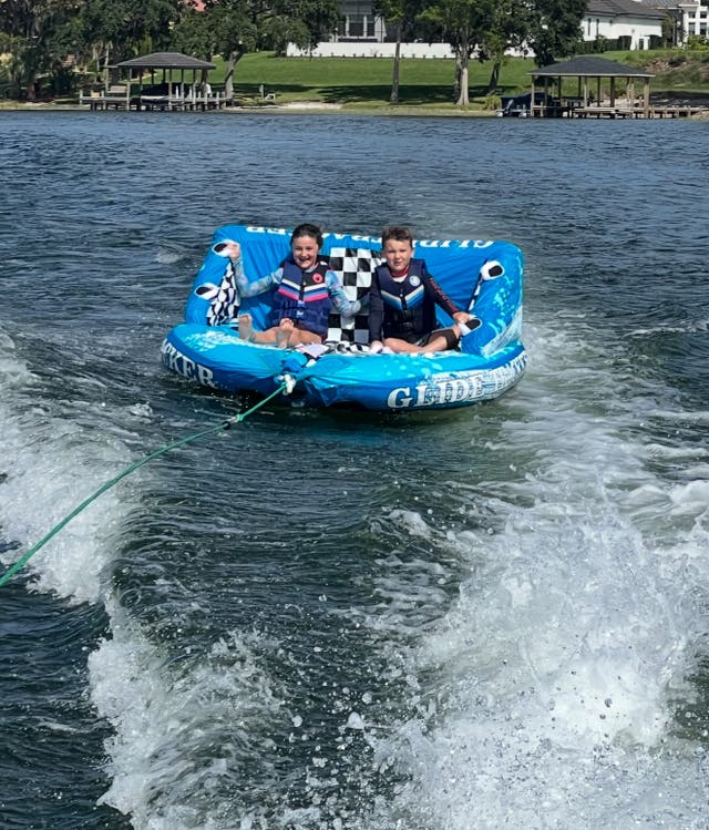 <p>Courtney Schultz's two children enjoying water sports as she 'raises them like it's the 90s'</p>