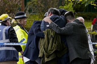 Members of the Jewish community relax each other near the Heaton Park and the Hebrew Community Synagogue in Crumpsall (Peter Byrne/PA)