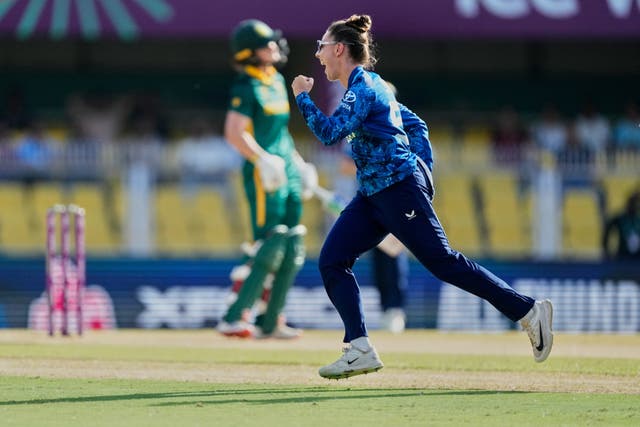 <p>England’s Linsey Smith celebrates the dismissal of South Africa captain Laura Wolvaardt (left), during their ICC Women’s Cricket World Cup match at Barsapara Cricket Stadium in Guwahati, India, on Friday</p>