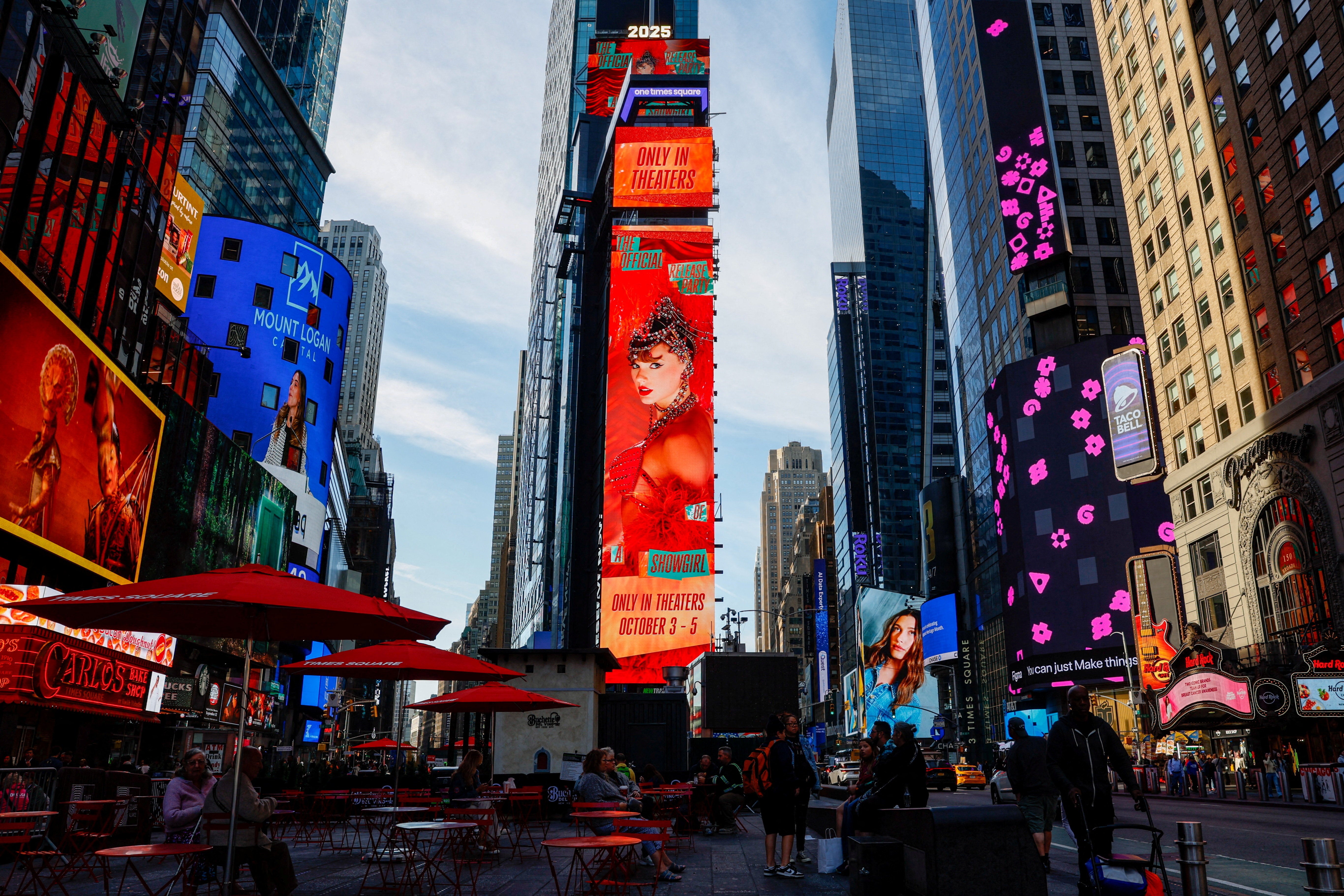 A billboard advertises ‘The Official Release Party of a Showgirl’ in Times Square