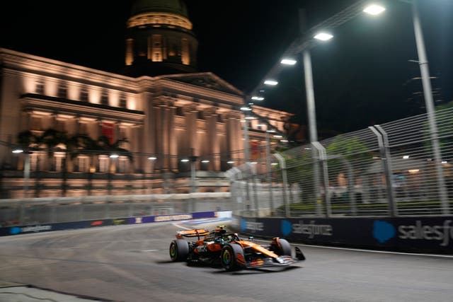 Lando Norris hit the concrete wall as he attempted to take evasive action (Vincent Thian/AP)