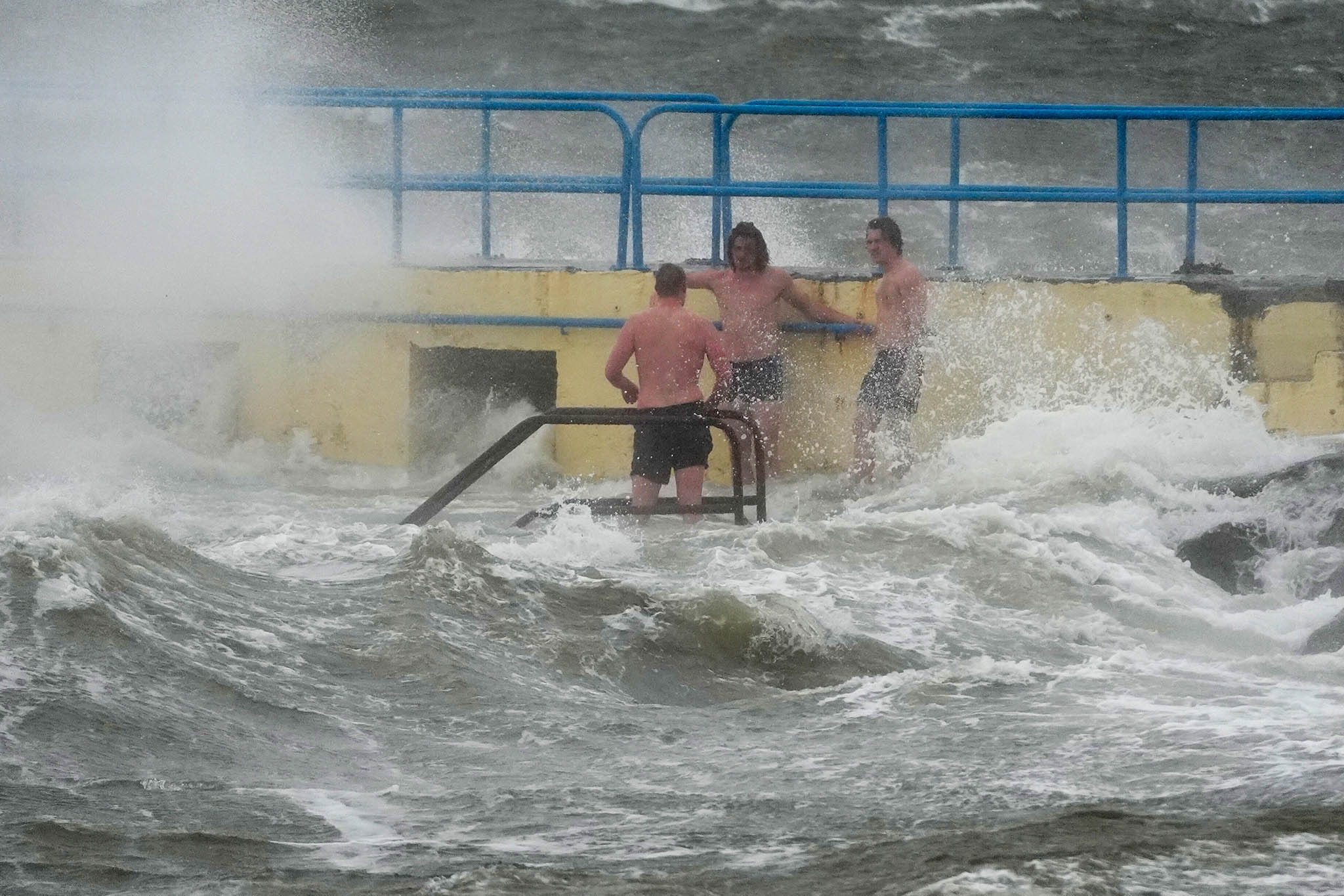 People on Blackrock diving tower in Salthill, Galway