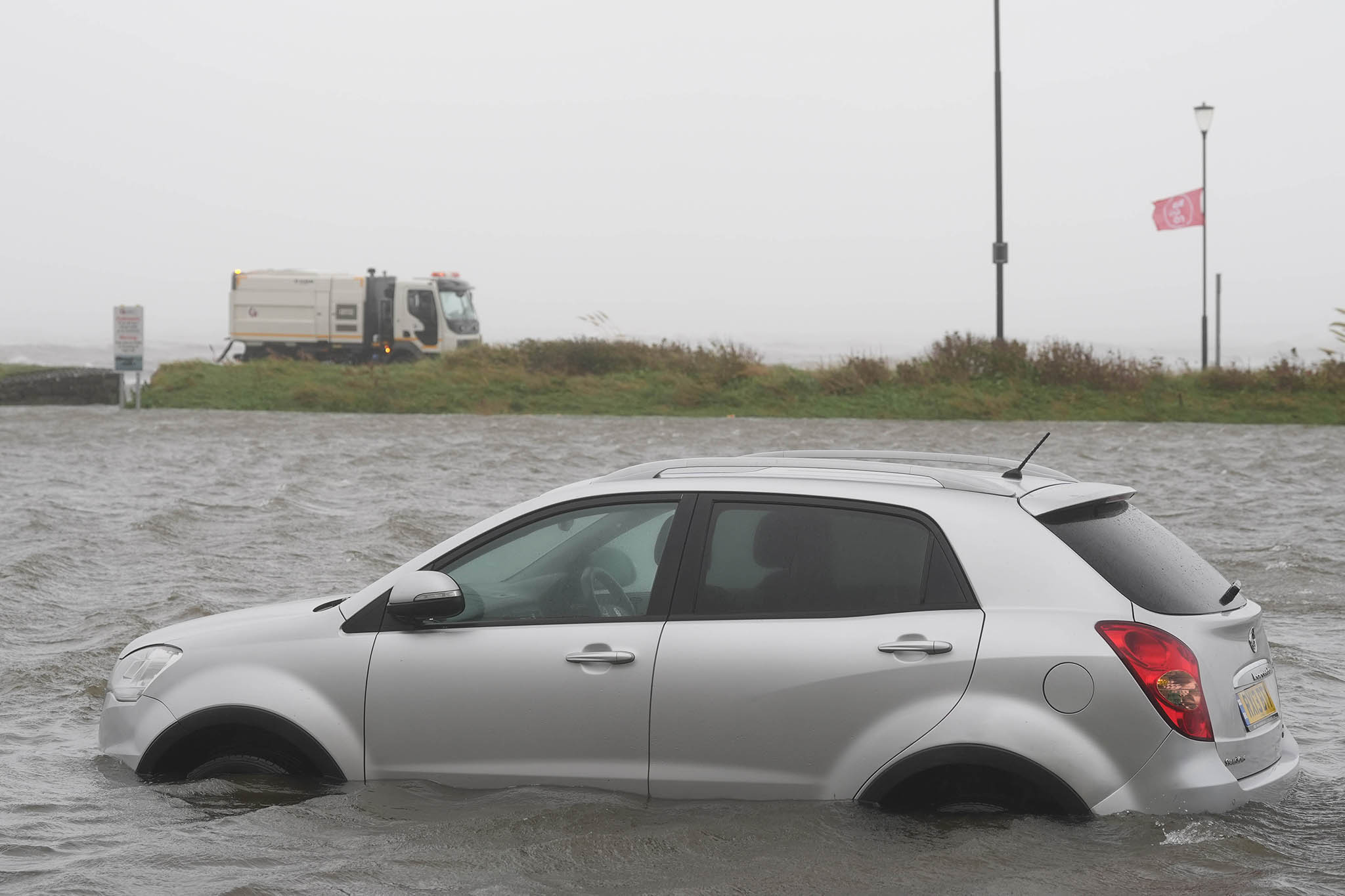 A car in a flooded carpark in Galway