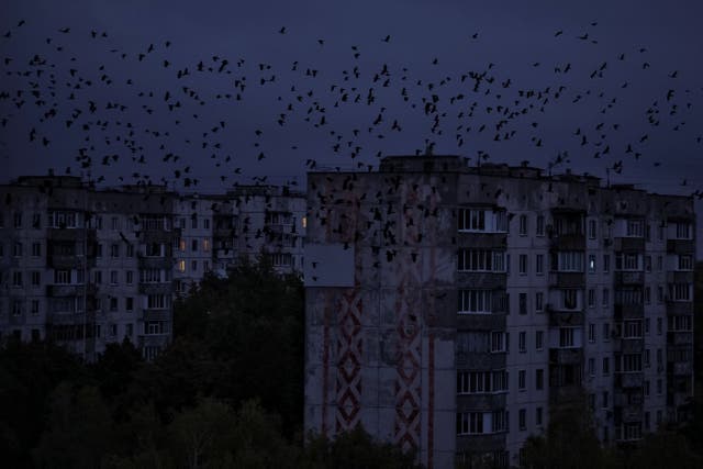 <p>Residential buildings are seen during a power blackout in Chernihiv</p>