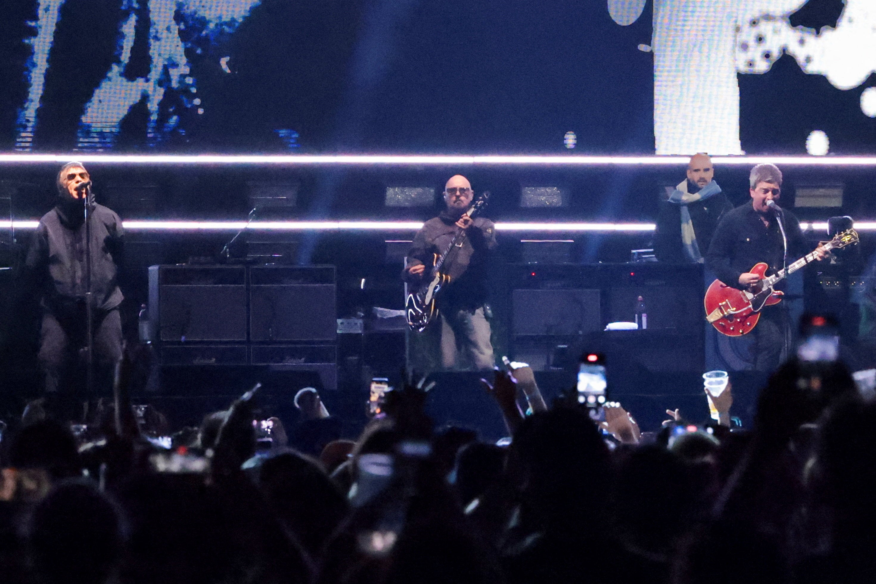 <p>Members of the British rock band Oasis, Liam Gallagher, Noel Gallagher and Paul "Bonehead" Arthurs perform during their Oasis Live '25 Tour </p>