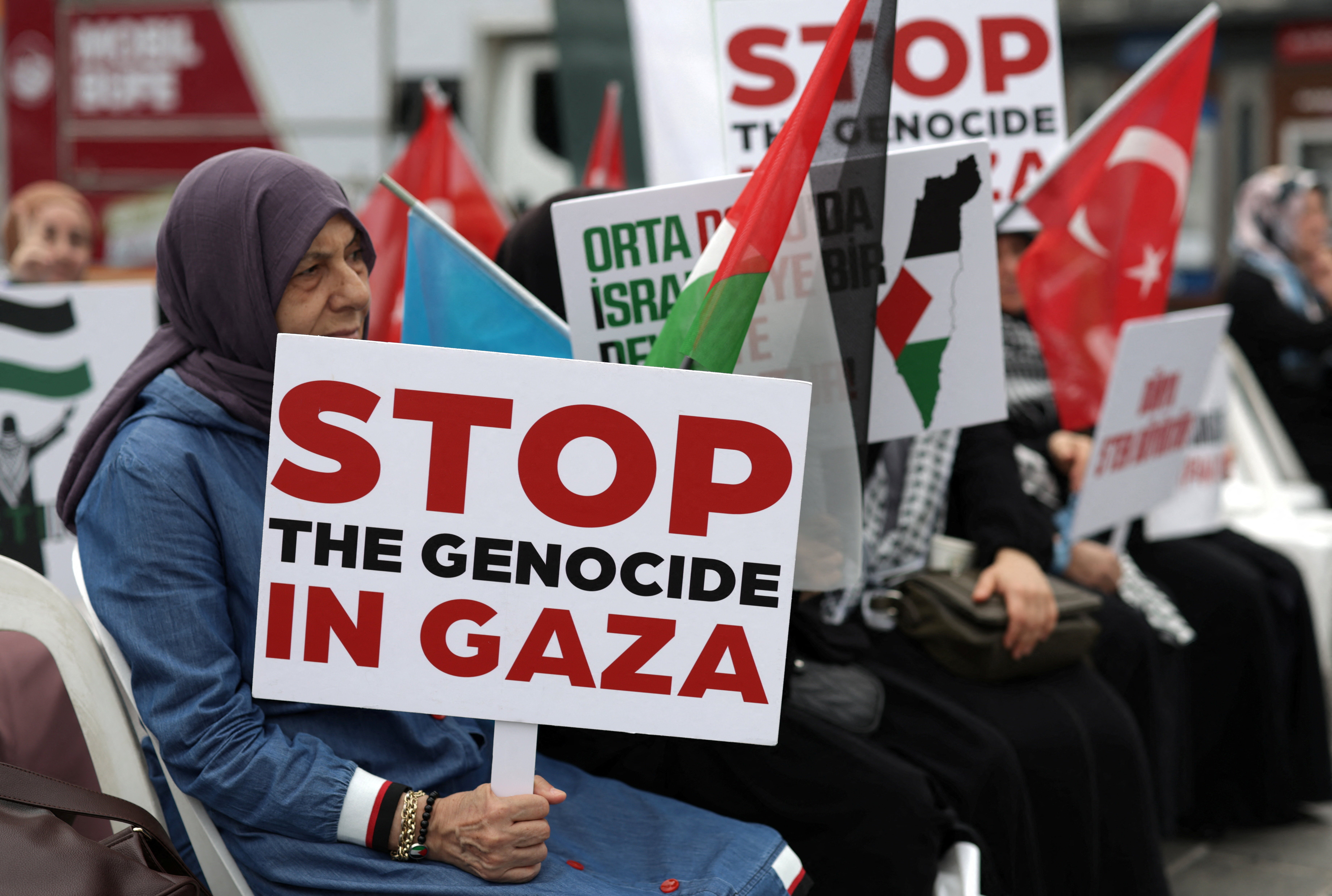 Pro-Palestinian demonstrators take part in a sit-in protest to condemn the Israeli forces' interception of the Global Sumud Flotilla vessels