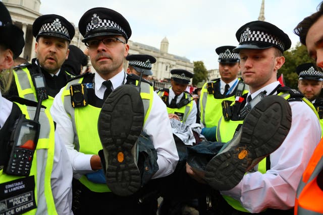 <p>The Met Police said many of those detained needed to be carried from Trafalgar Square </p>