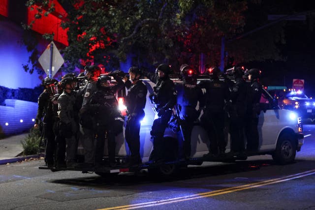 <p>Portland Police load onto a van as people protest outside a U.S. Immigration and Customs Enforcement facility in Portland, Oregon, Friday, Oct. 3, 2025</p>