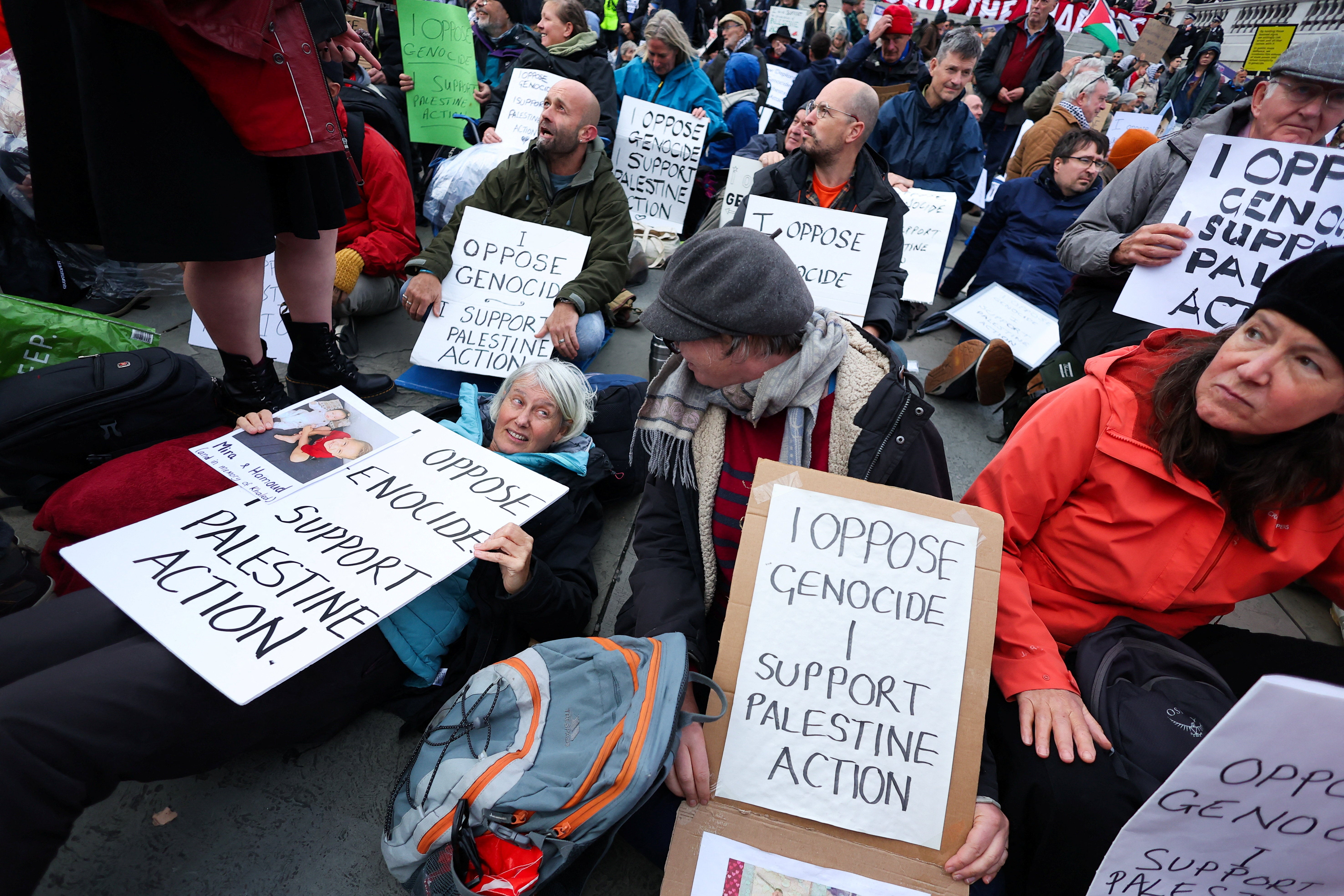 Protesters hold placards during a mass demonstration organised by Defend Our Juries in London earlier this month