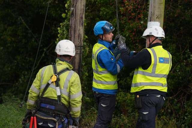 Electricity Supply Board (ESB) carry out repairs to fallen power cables in Balbriggan, Co. Dublin (Brian Lawless/PA)