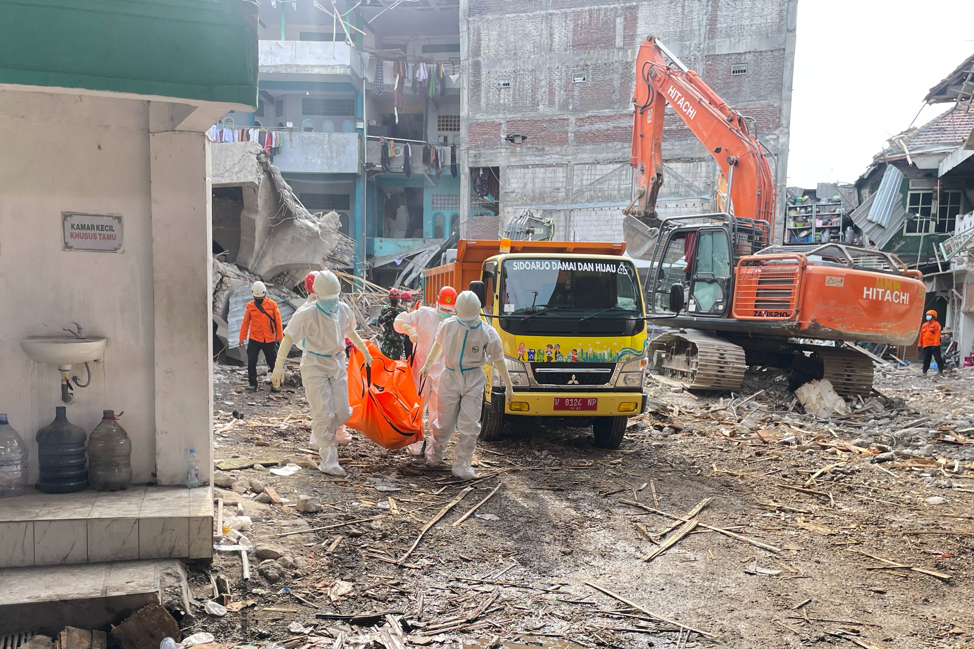 <p>Rescuers continue to work on ground to find victims after a school collapsed in Indonesia</p>