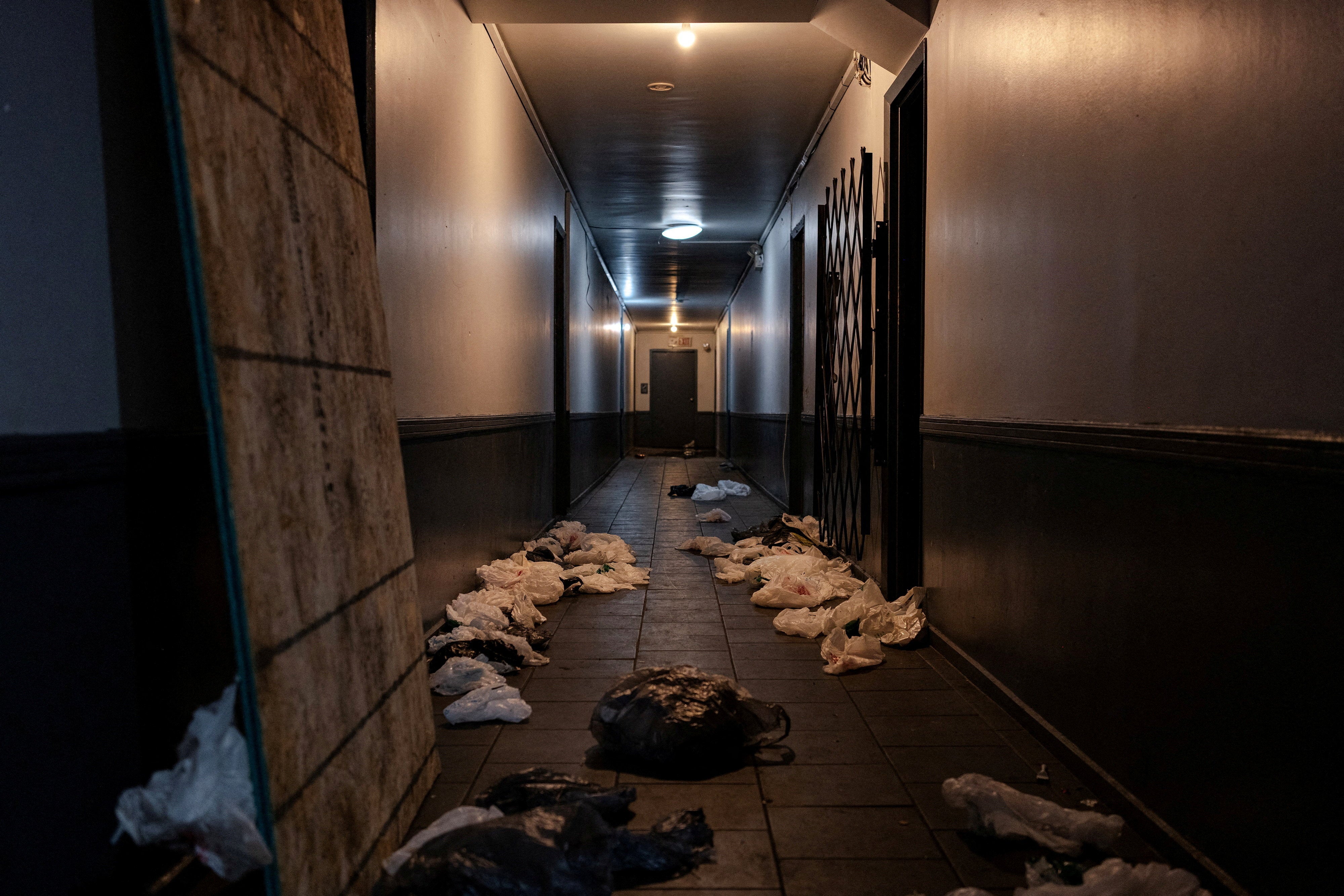 Clothing and toys were among the belongings discarded by law enforcement in the hallway of the building after the raid