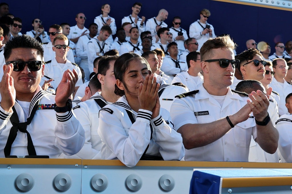 Members of the crowd, mostly cadets, cheered at points in Trump's speech which verged into political subjects