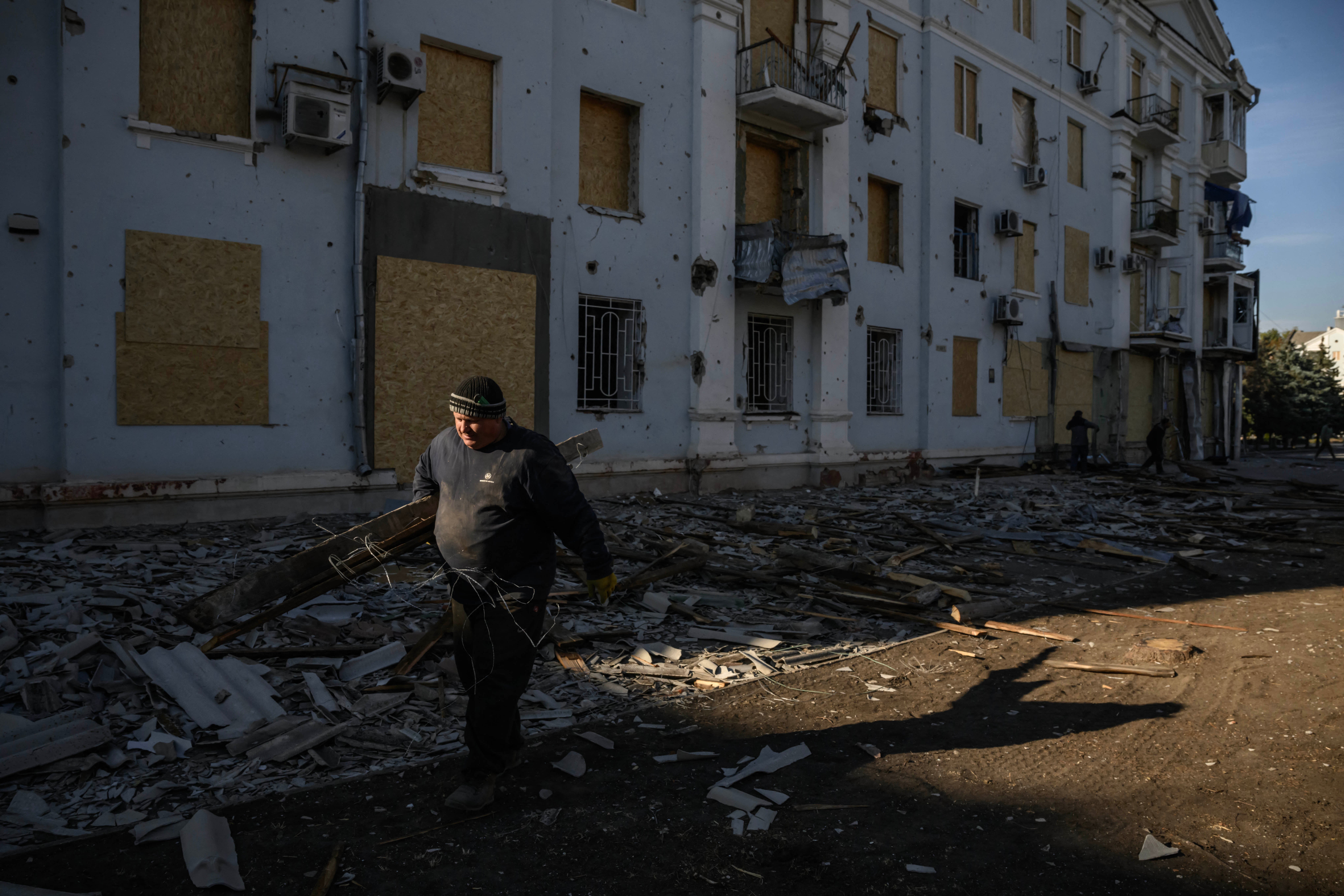 A man salvages wood from a building damaged in a recent Russian strike, in Kramatorsk, eastern Ukraine on 2 October 2025