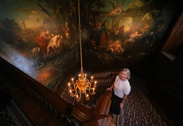 <p>Wendy Porter, a nurse at the hospital, stands in the Grand Staircase of the North Wing of St Bartholomew’s Hospital in West Smithfield, central London </p>